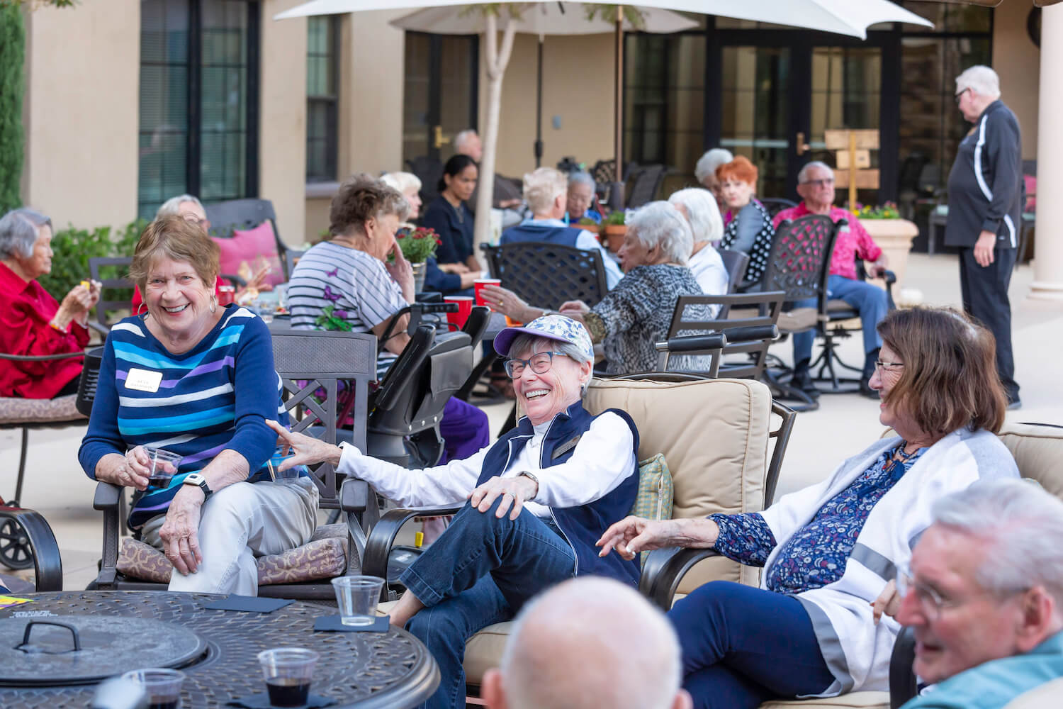 Ladies socializing around an outdoor table